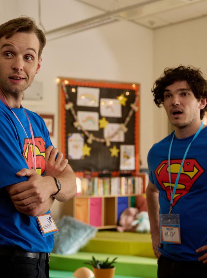 Lost Boys & Fairies Gabriel and Andy in a scene wearing matching superman t-shirts