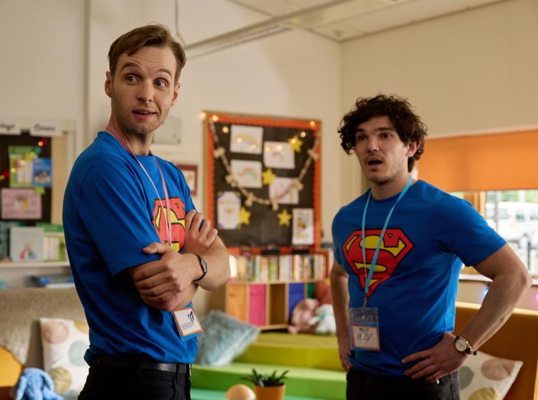 Lost Boys & Fairies Gabriel and Andy in a scene wearing matching superman t-shirts